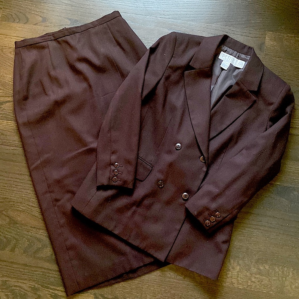 Double breasted fully lined 100% wool suit.  Jacket size 8.  Long skirt size 10